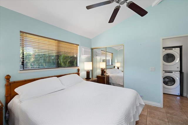 2825 Kauhale St, Kihei, HI 96753 - bedroom with stacked washing machine and dryer, vaulted ceiling, multiple windows, a closet, and tile patterned floors