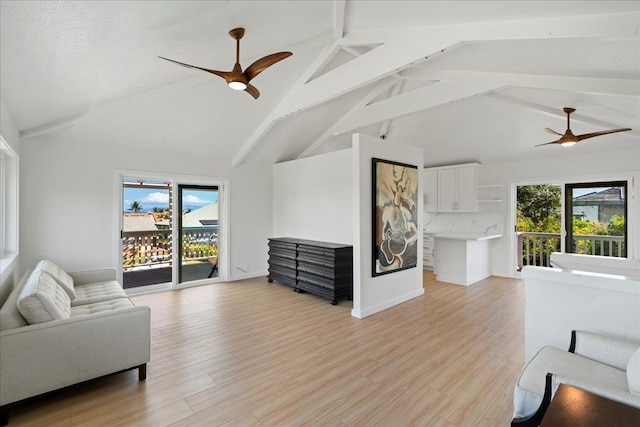 2825 Kauhale St, Kihei, HI 96753 - living room with ceiling fan, healthy amount of natural light, beam ceiling, light wood-type flooring, and high vaulted ceiling