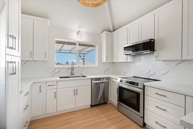 2825 Kauhale St, Kihei, HI 96753 - kitchen featuring stainless steel appliances, white cabinetry, tasteful backsplash, and light wood finished floors