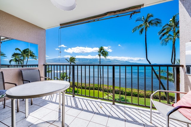 balcony with a water and mountain view