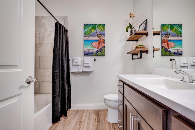 full bathroom with shower / bathtub combination with curtain, vanity, toilet, and wood-type flooring