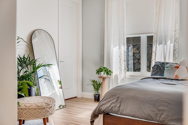 bedroom with light hardwood / wood-style flooring