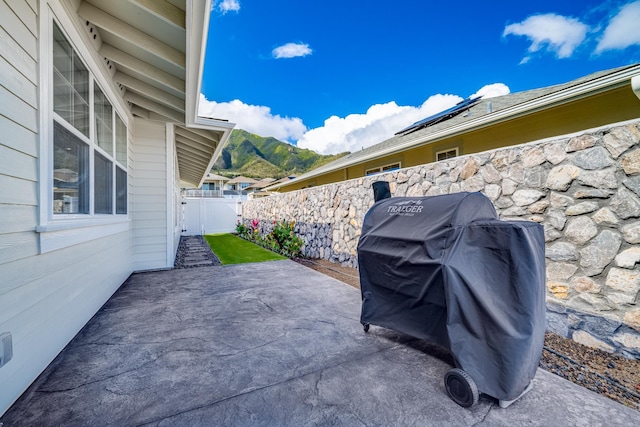 view of patio featuring a grill and a mountain view