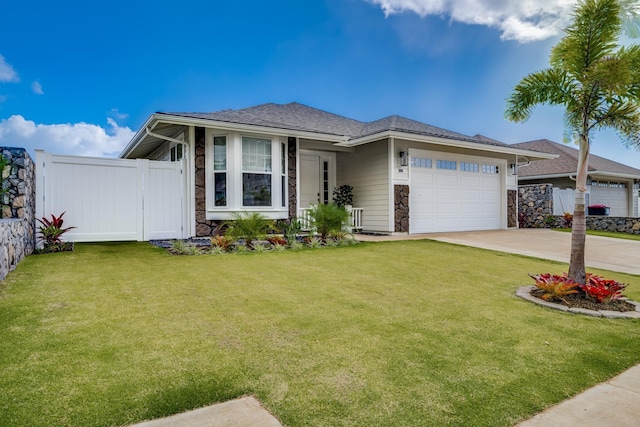 view of front of property featuring a garage and a front lawn