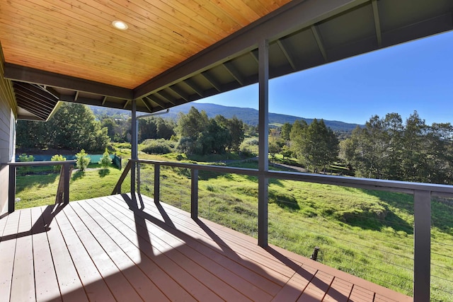 wooden deck featuring a mountain view