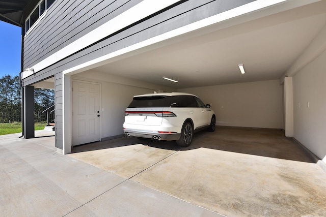 garage featuring a carport