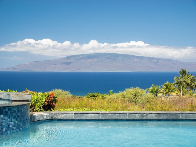 view of pool with a mountain view