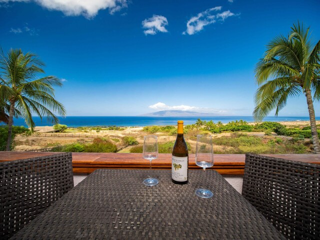 view of patio with a water view