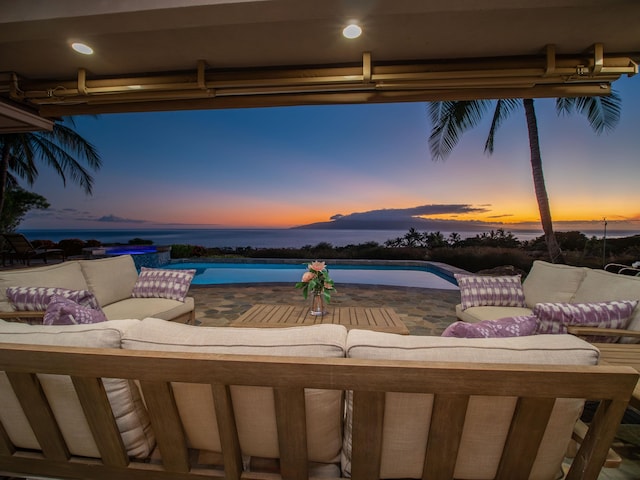 exterior space with a patio and a water view