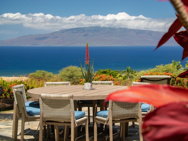 exterior space featuring a water and mountain view