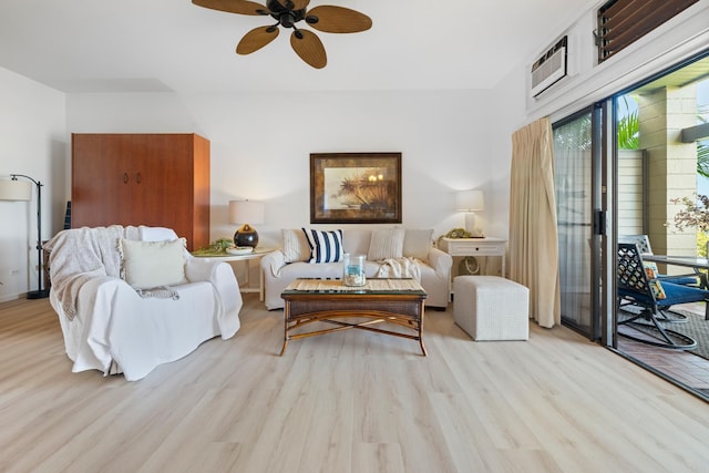 living room with ceiling fan and light wood-type flooring