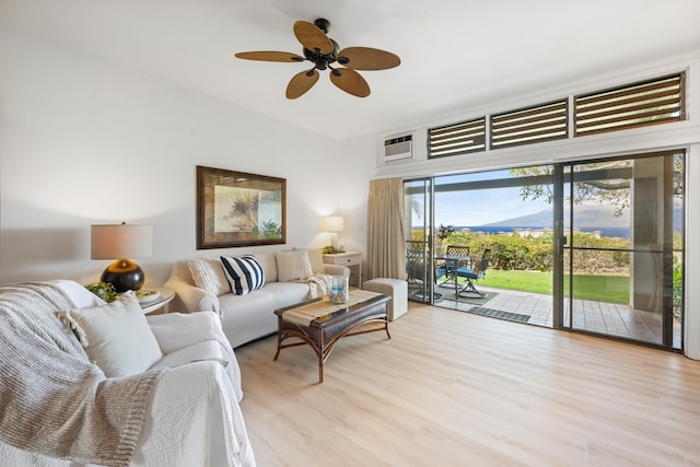living room featuring ceiling fan and light wood-type flooring