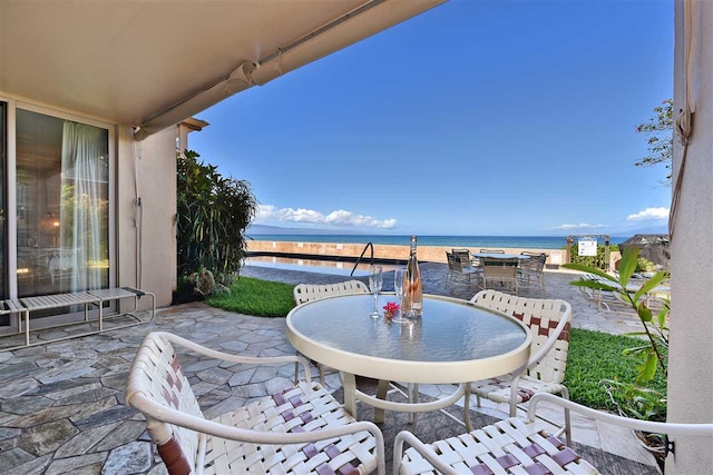 view of patio / terrace with a water view