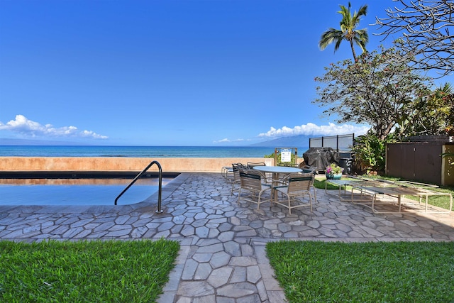 view of patio featuring a water view