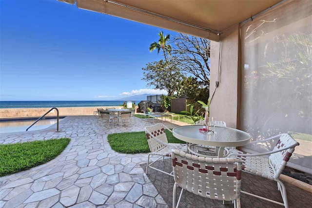 view of patio featuring a water view