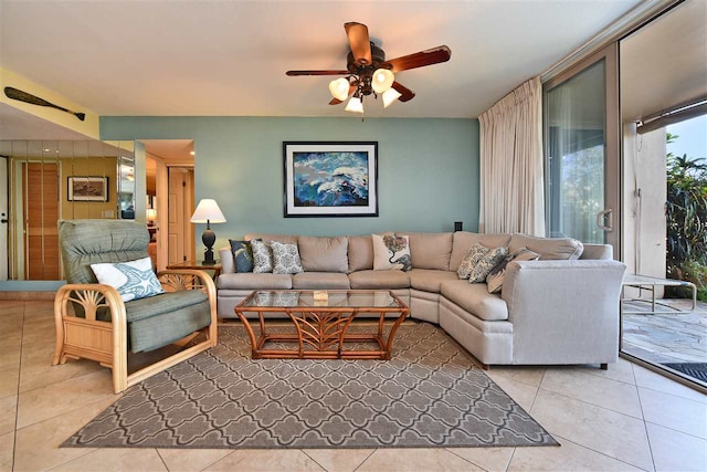 tiled living room featuring ceiling fan