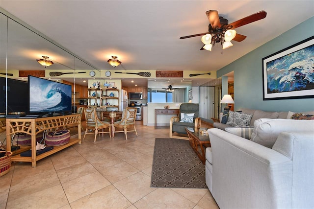 living room with ceiling fan and light tile patterned flooring