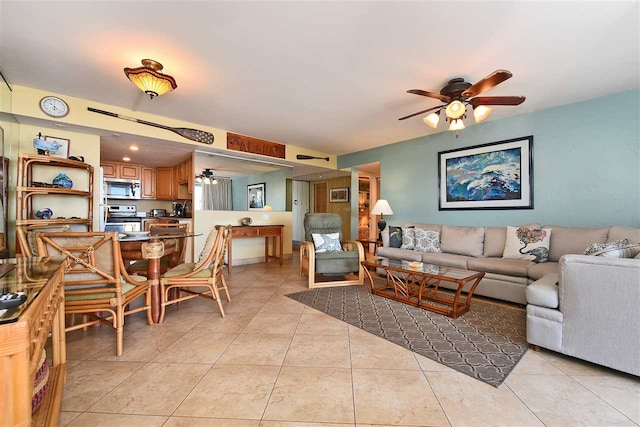 living room with ceiling fan and light tile patterned floors