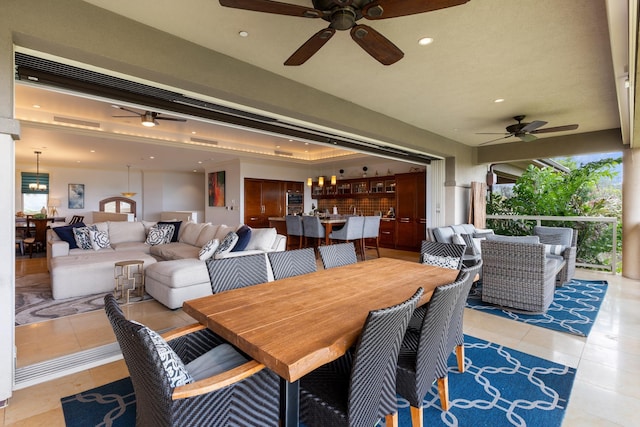 dining room with ceiling fan and light tile patterned floors