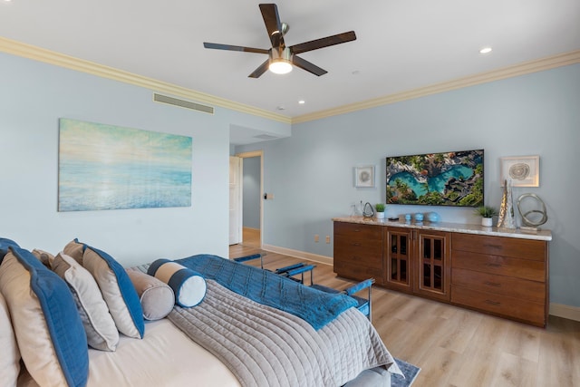 bedroom featuring ornamental molding, ceiling fan, and light hardwood / wood-style flooring