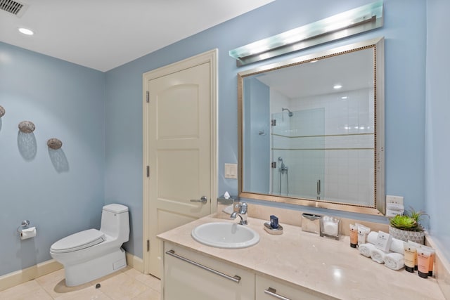 bathroom featuring vanity, toilet, walk in shower, and tile patterned floors