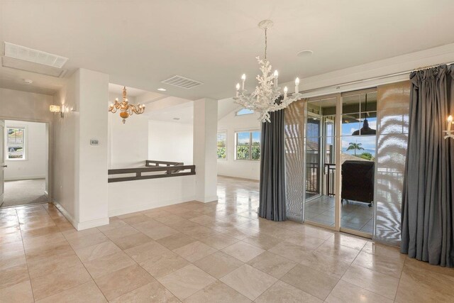 empty room with a notable chandelier