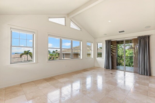 tiled empty room with vaulted ceiling with beams