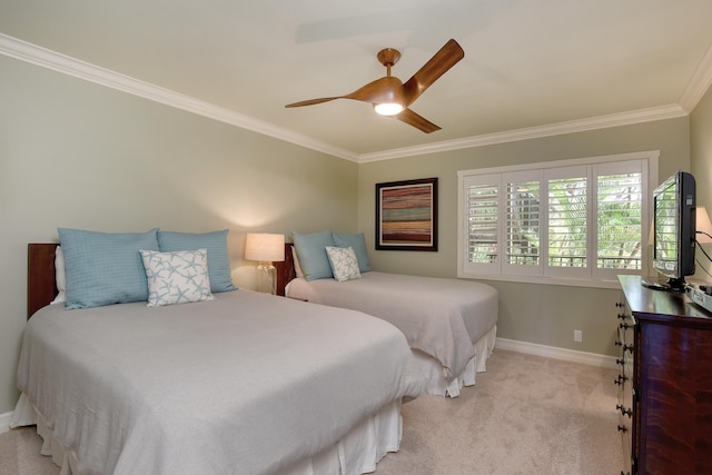 carpeted bedroom featuring ceiling fan and ornamental molding