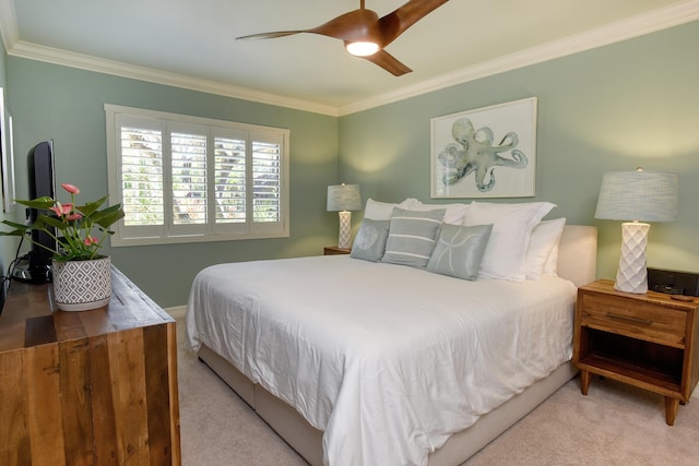 bedroom featuring ceiling fan, ornamental molding, and light colored carpet