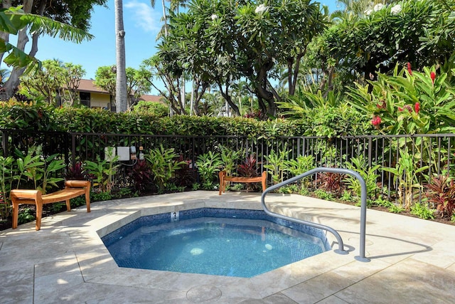 view of pool with an in ground hot tub and a patio area