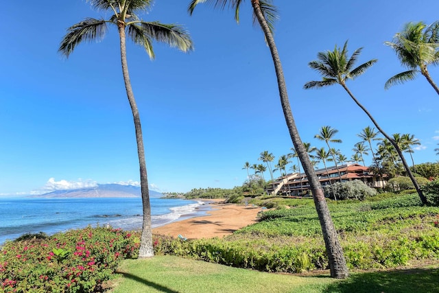 water view with a beach view and a mountain view