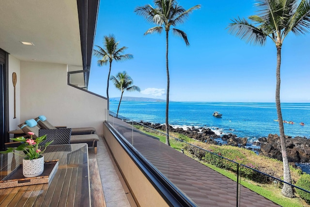 balcony featuring a water view