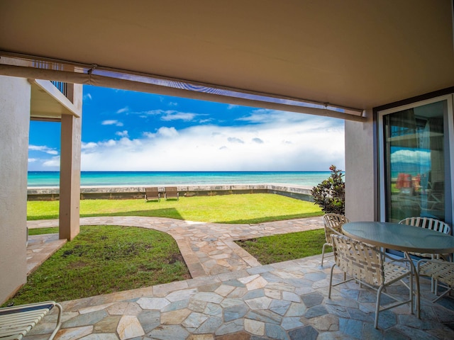 view of patio featuring a water view