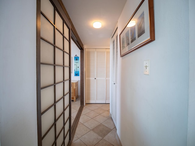 hallway featuring light tile patterned floors