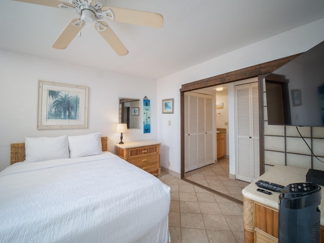 tiled bedroom featuring a closet and ceiling fan