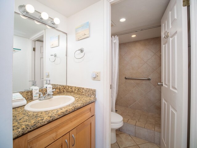 bathroom with tile patterned floors, toilet, a shower with curtain, and vanity