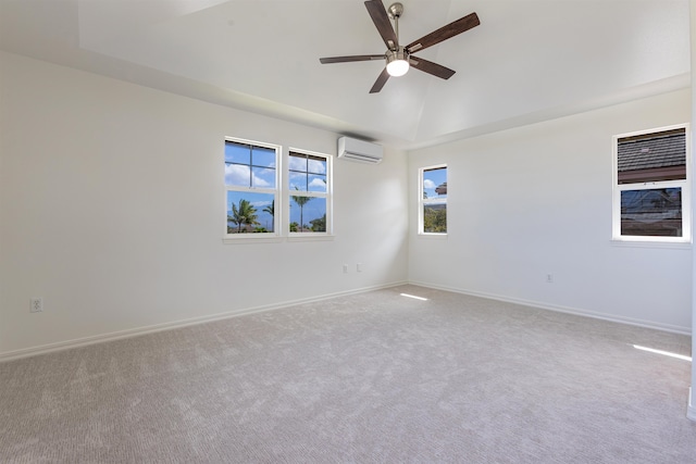 carpeted empty room with a wall unit AC, ceiling fan, and vaulted ceiling