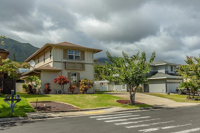 view of front property featuring a mountain view and a front lawn