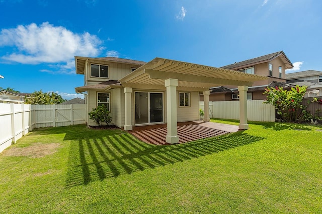 back of house featuring a yard, a pergola, and a patio area