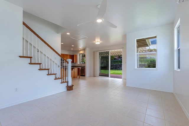 tiled entrance foyer featuring ceiling fan