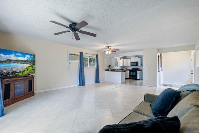 living area featuring a textured ceiling, light tile patterned floors, and baseboards