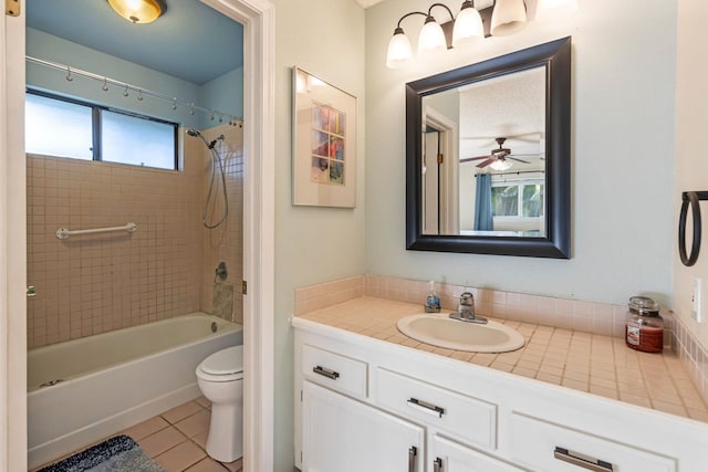 bathroom featuring toilet, vanity, shower / washtub combination, and tile patterned floors