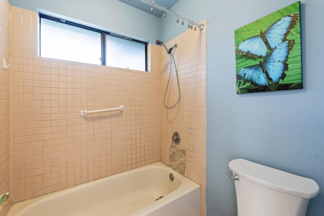 bathroom featuring toilet and washtub / shower combination