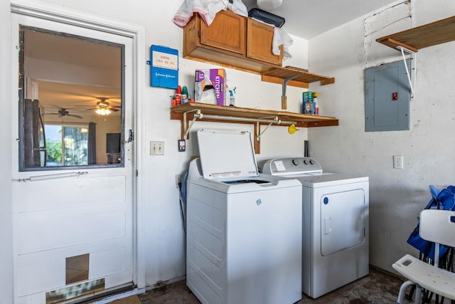 clothes washing area featuring separate washer and dryer and electric panel