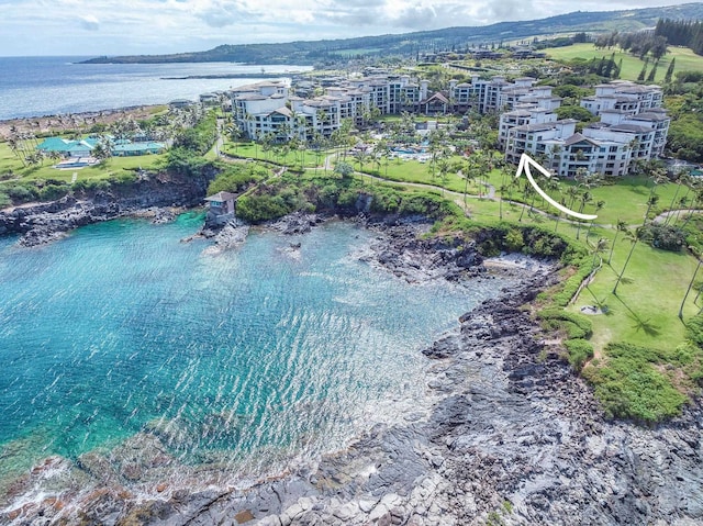 birds eye view of property with a water view