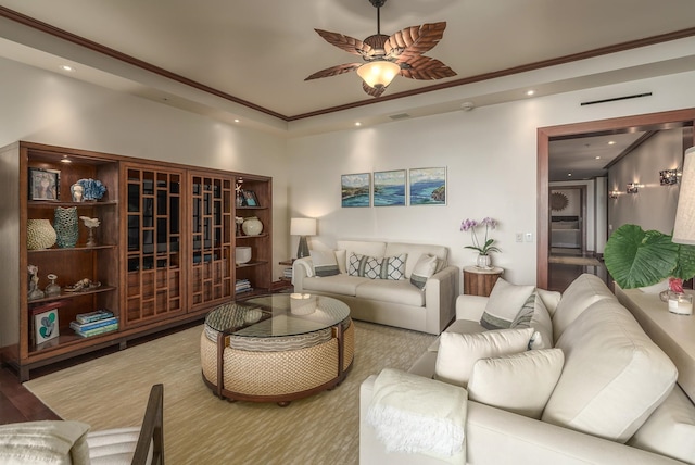 living room with crown molding and ceiling fan