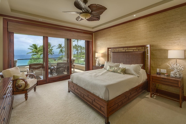 carpeted bedroom featuring a water view, access to exterior, and ceiling fan