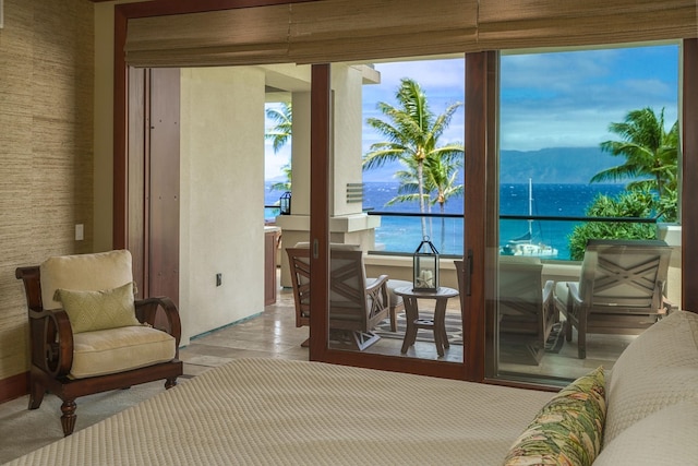 entryway with a water and mountain view