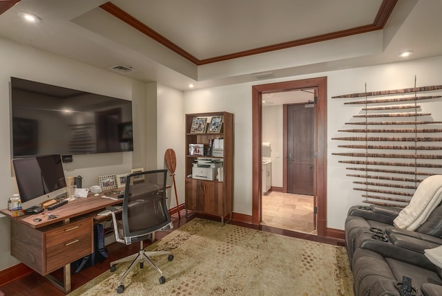 office area featuring crown molding and a raised ceiling