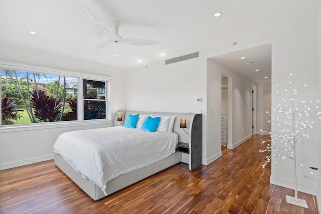 bedroom with ceiling fan and dark hardwood / wood-style flooring